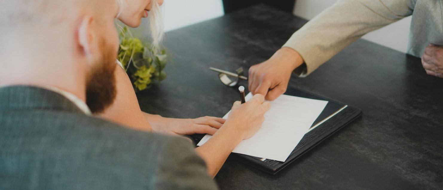 a couple signing a marital agreement in california